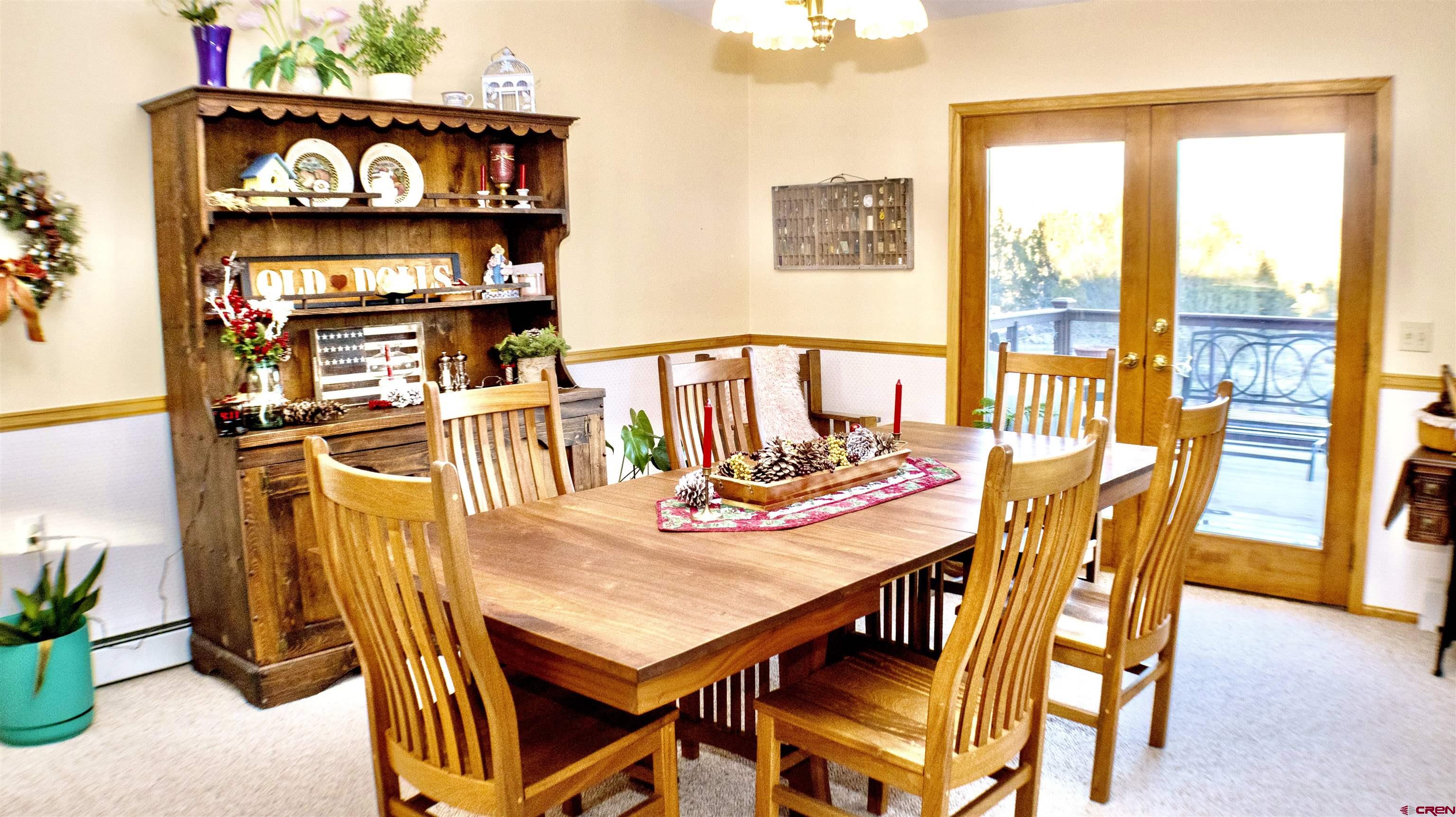 32179 L Road Hotchkiss, CO 81419 - Photo 11 of 45 a view of a dining room with furniture and a potted plant