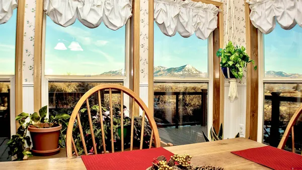 a view of a balcony with chair and table