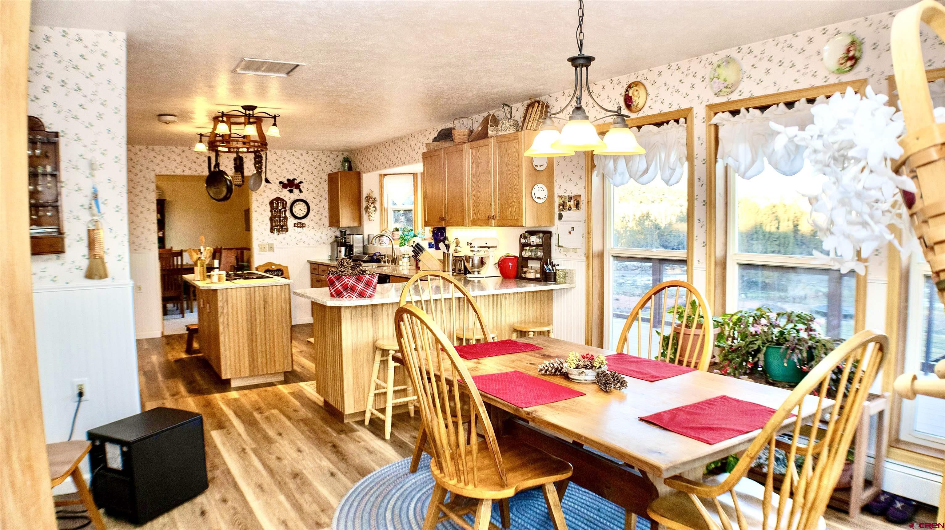 32179 L Road Hotchkiss, CO 81419 - Photo 16 of 45 a view of a dining room with furniture and chandelier