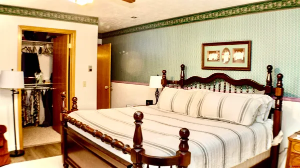 a bedroom with a bed and the view of bedroom