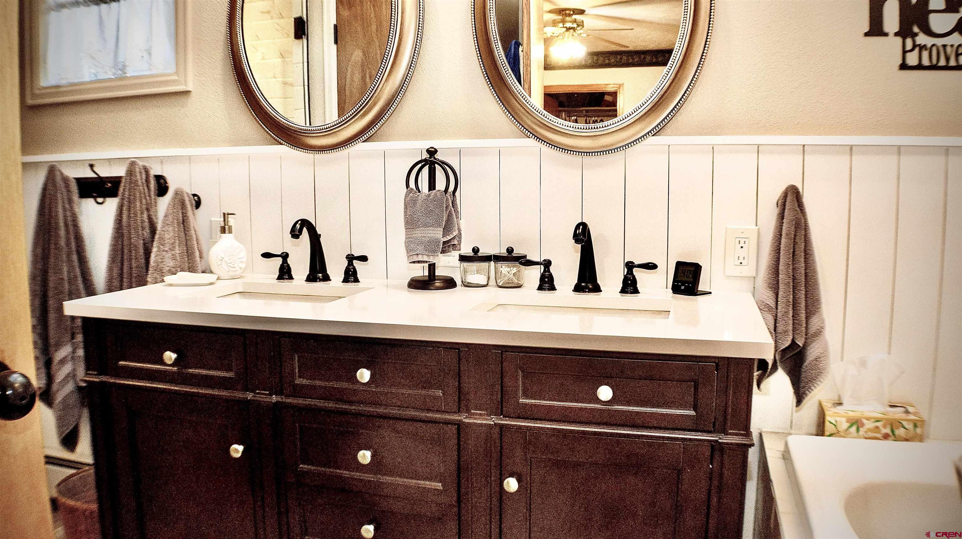 32179 L Road Hotchkiss, CO 81419 - Photo 20 of 45 a bathroom with a sink and a mirror