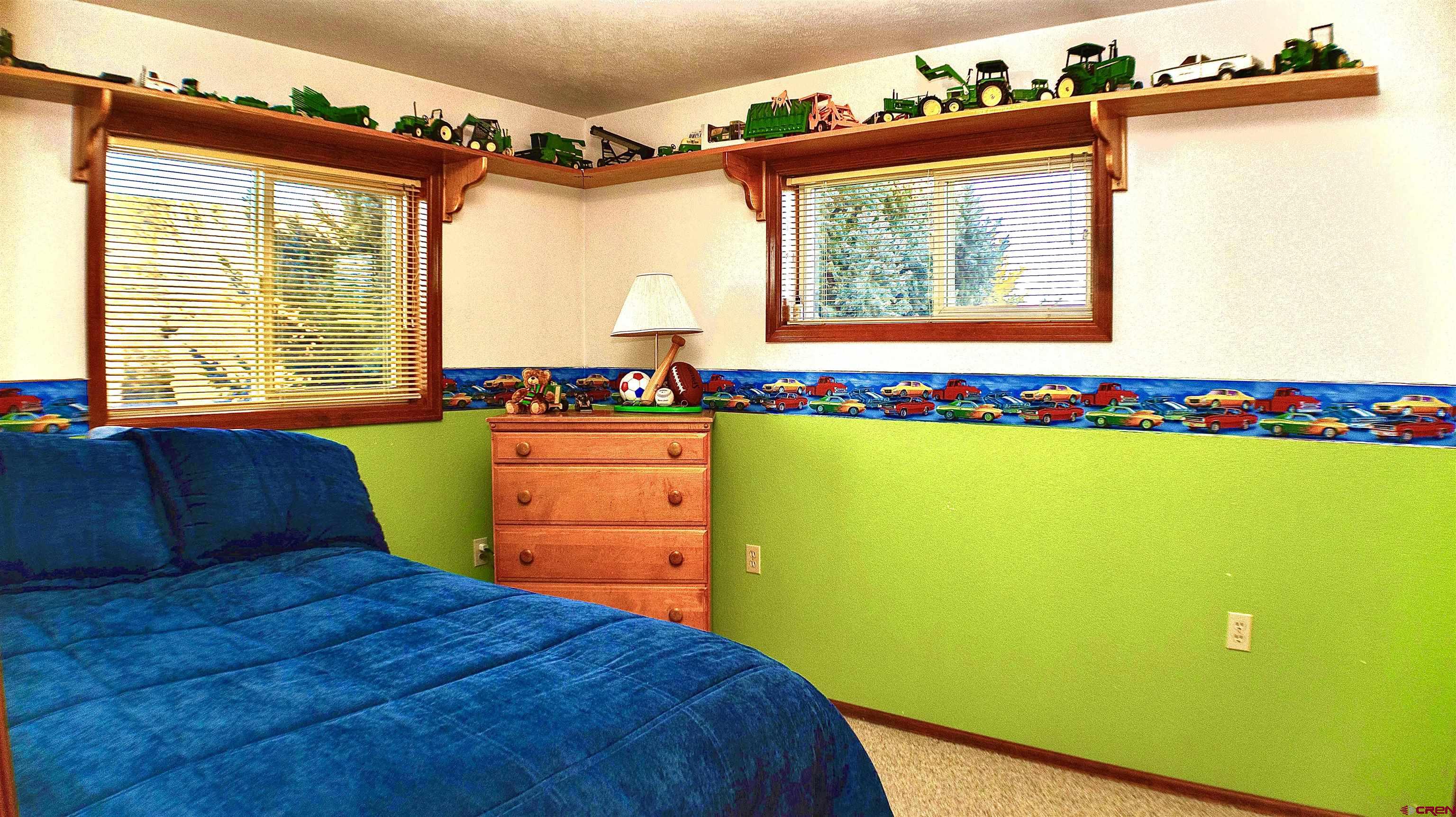 32179 L Road Hotchkiss, CO 81419 - Photo 24 of 45 a bed room with a bed and a chair