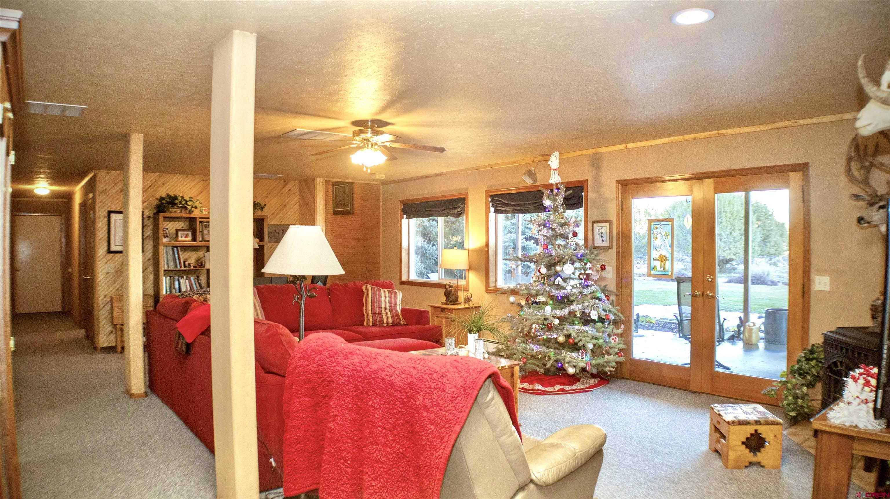 32179 L Road Hotchkiss, CO 81419 - Photo 29 of 45 a living room with furniture and a large window