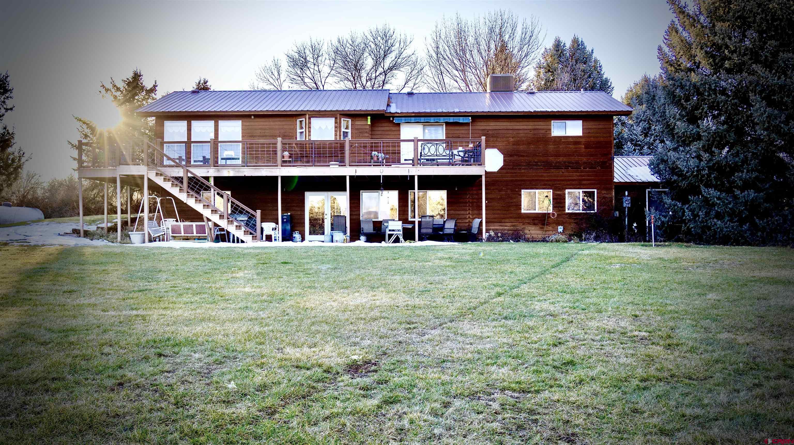 32179 L Road Hotchkiss, CO 81419 - Photo 3 of 45 a view of a building with a yard