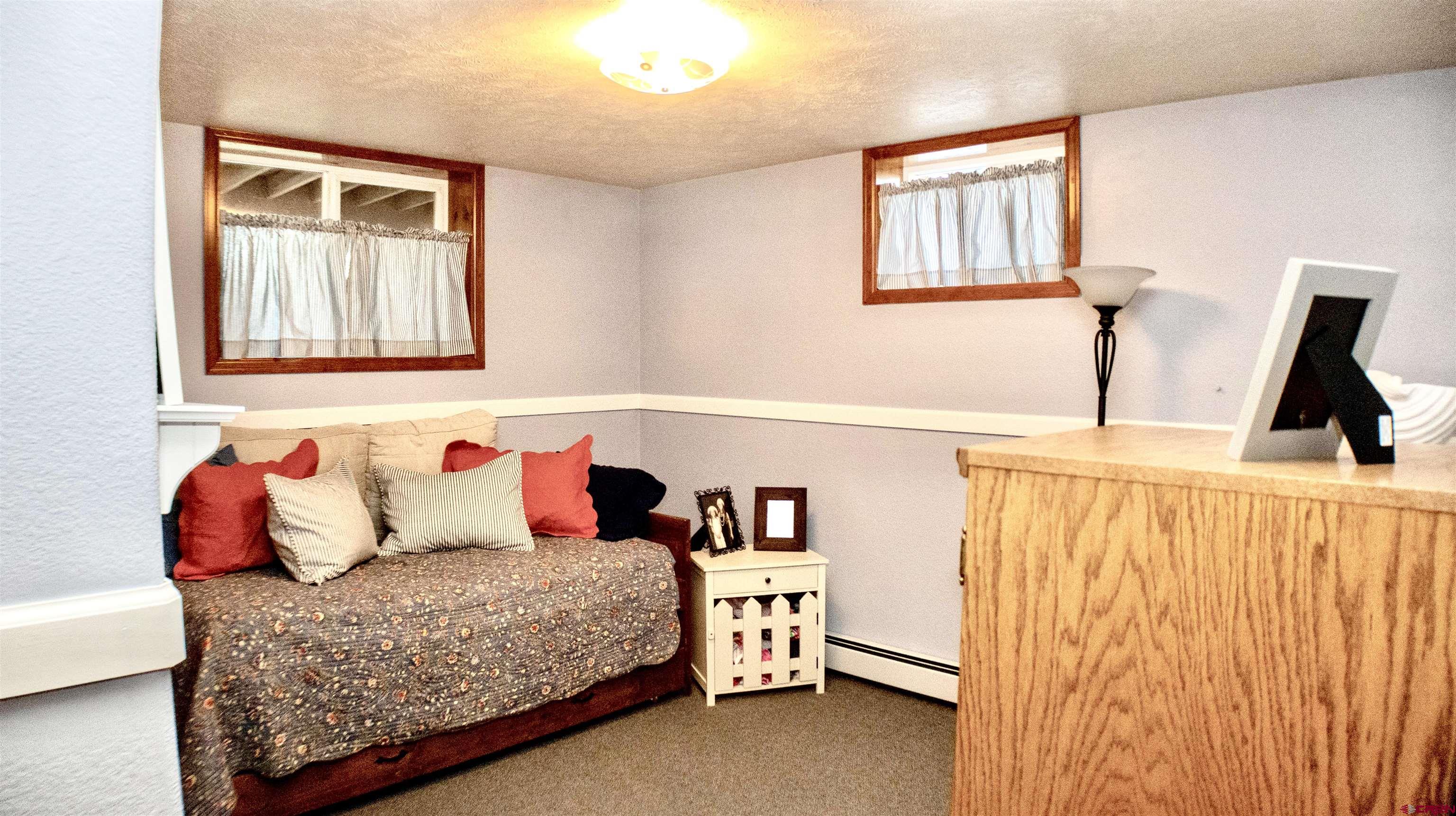 32179 L Road Hotchkiss, CO 81419 - Photo 31 of 45 a bedroom with a bed and a window