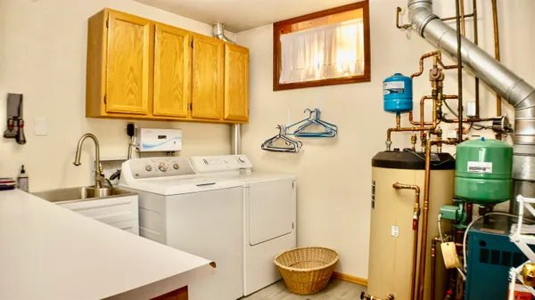 a kitchen with a sink stove and cabinets
