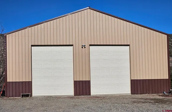 a view of a house with a garage