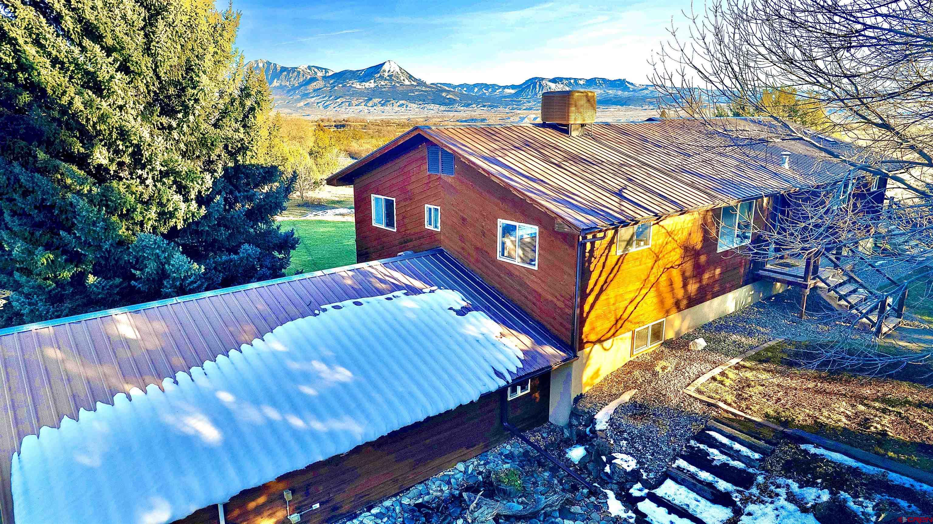 32179 L Road Hotchkiss, CO 81419 - Photo 8 of 45 a view of a house with a yard