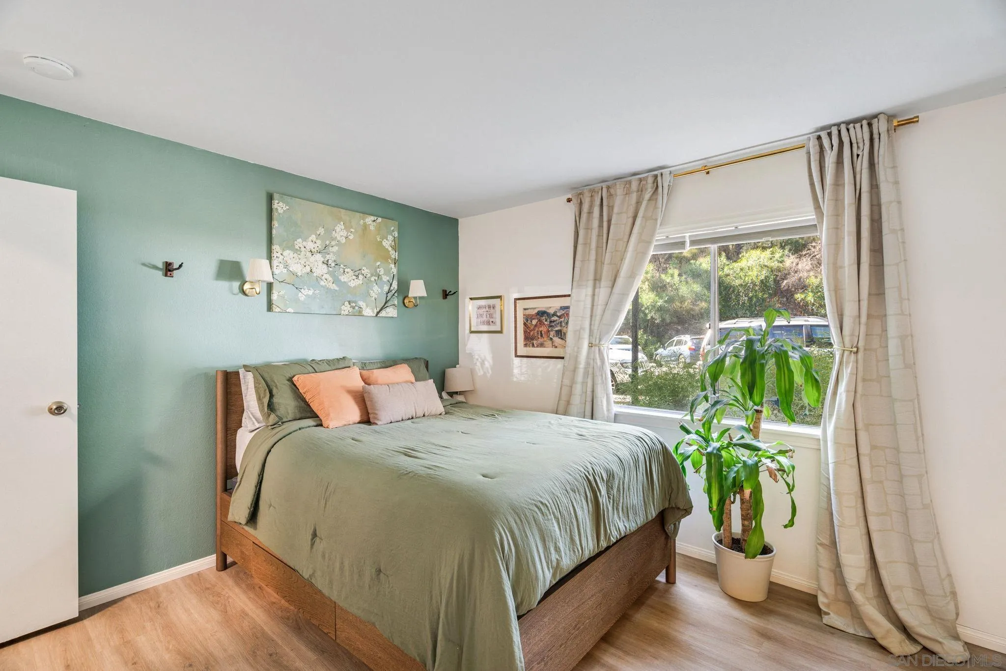 5553 Adobe Falls Road, Unit 1 San Diego, CA 92120 - Photo 13 of 21 a bedroom with a bed and a window