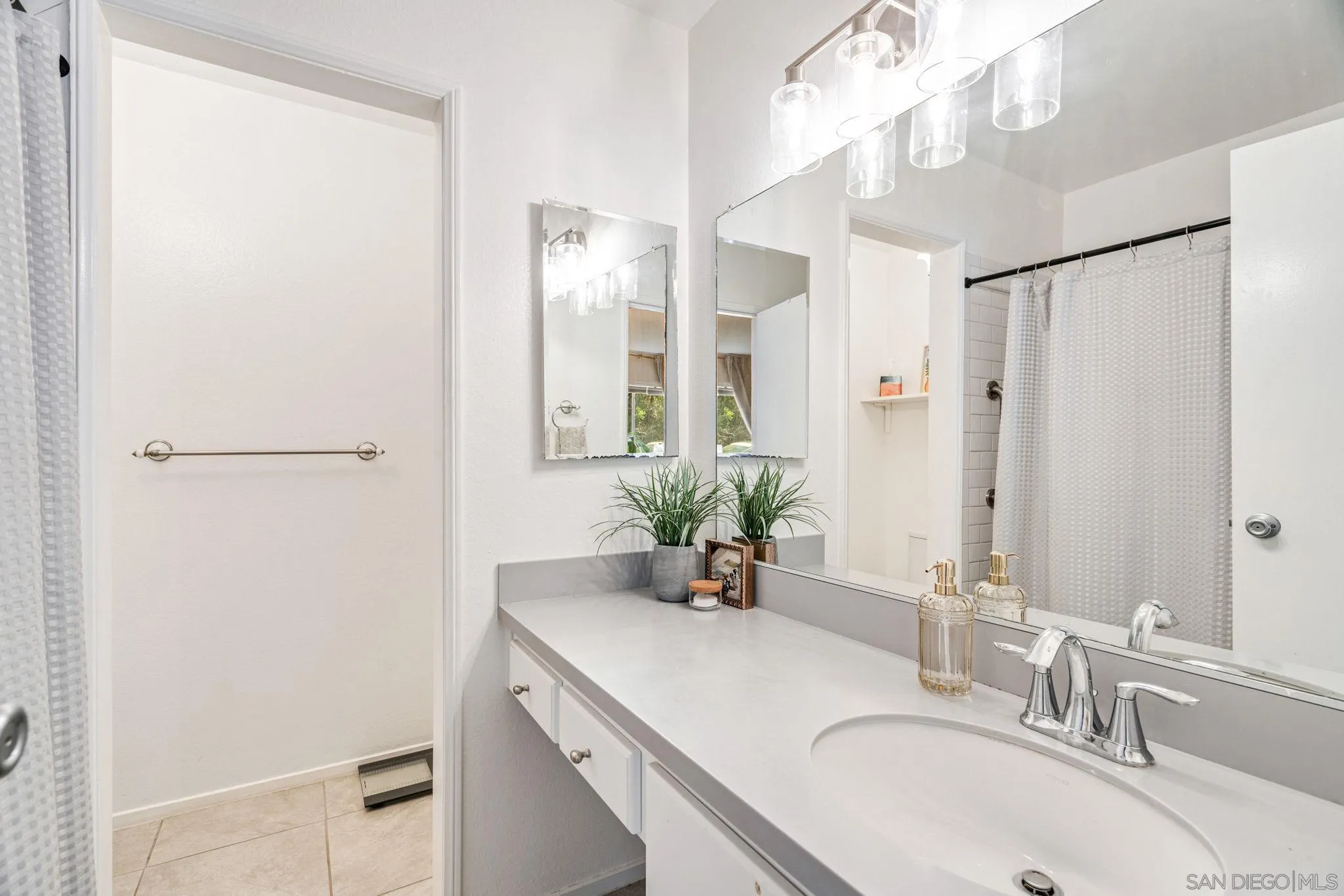 5553 Adobe Falls Road, Unit 1 San Diego, CA 92120 - Photo 15 of 21 a bathroom with a granite countertop sink a mirror and a shower