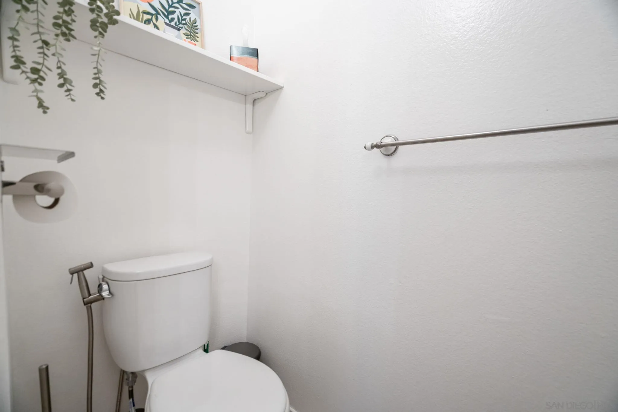 5553 Adobe Falls Road, Unit 1 San Diego, CA 92120 - Photo 17 of 21 a white toilet sitting next to a white wall