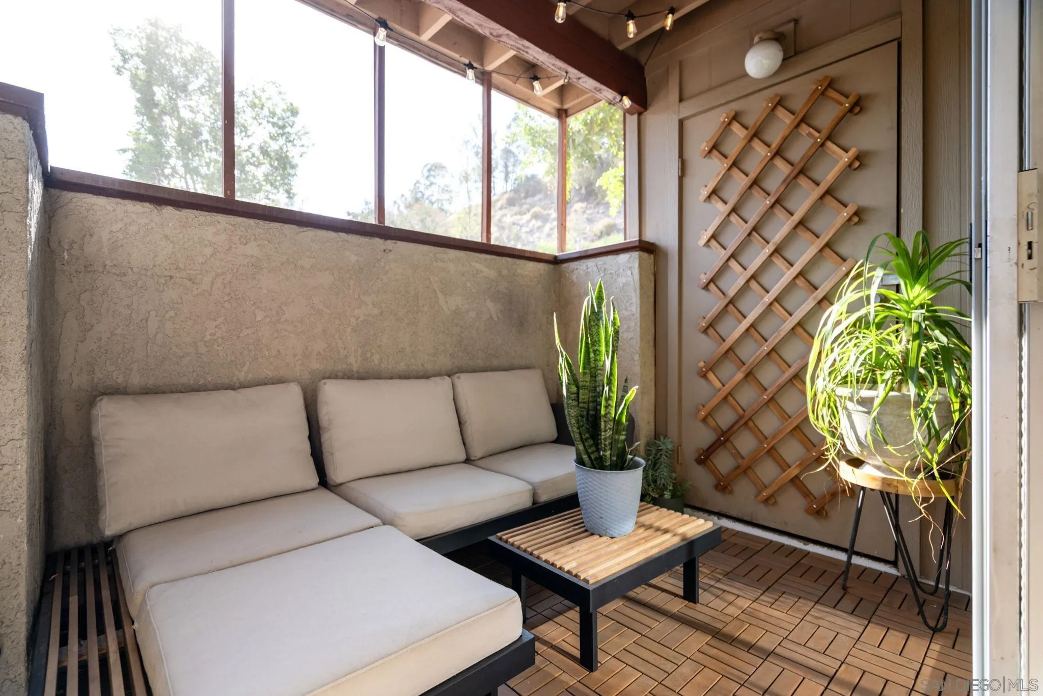 5553 Adobe Falls Road, Unit 1 San Diego, CA 92120 - Photo 20 of 21 a living room with furniture and a potted plant