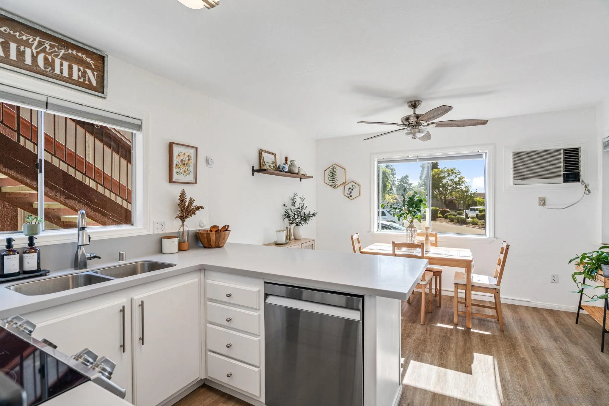 5553 Adobe Falls Road, Unit 1 San Diego, CA 92120 - Photo 2 of 21 a kitchen with a sink cabinets and window