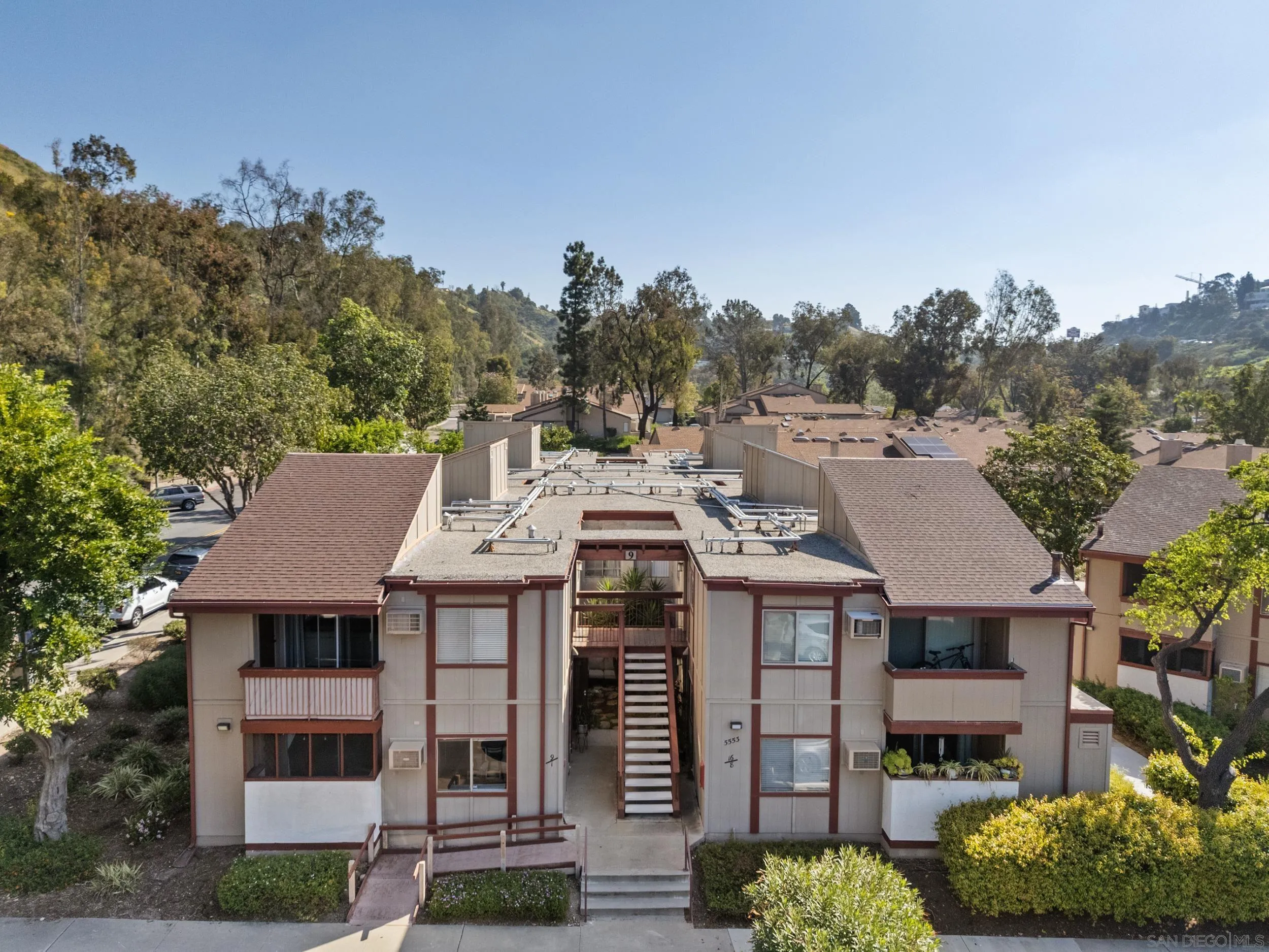 5553 Adobe Falls Road, Unit 1 San Diego, CA 92120 - Photo 21 of 21 a large building with a clock tower in the middle