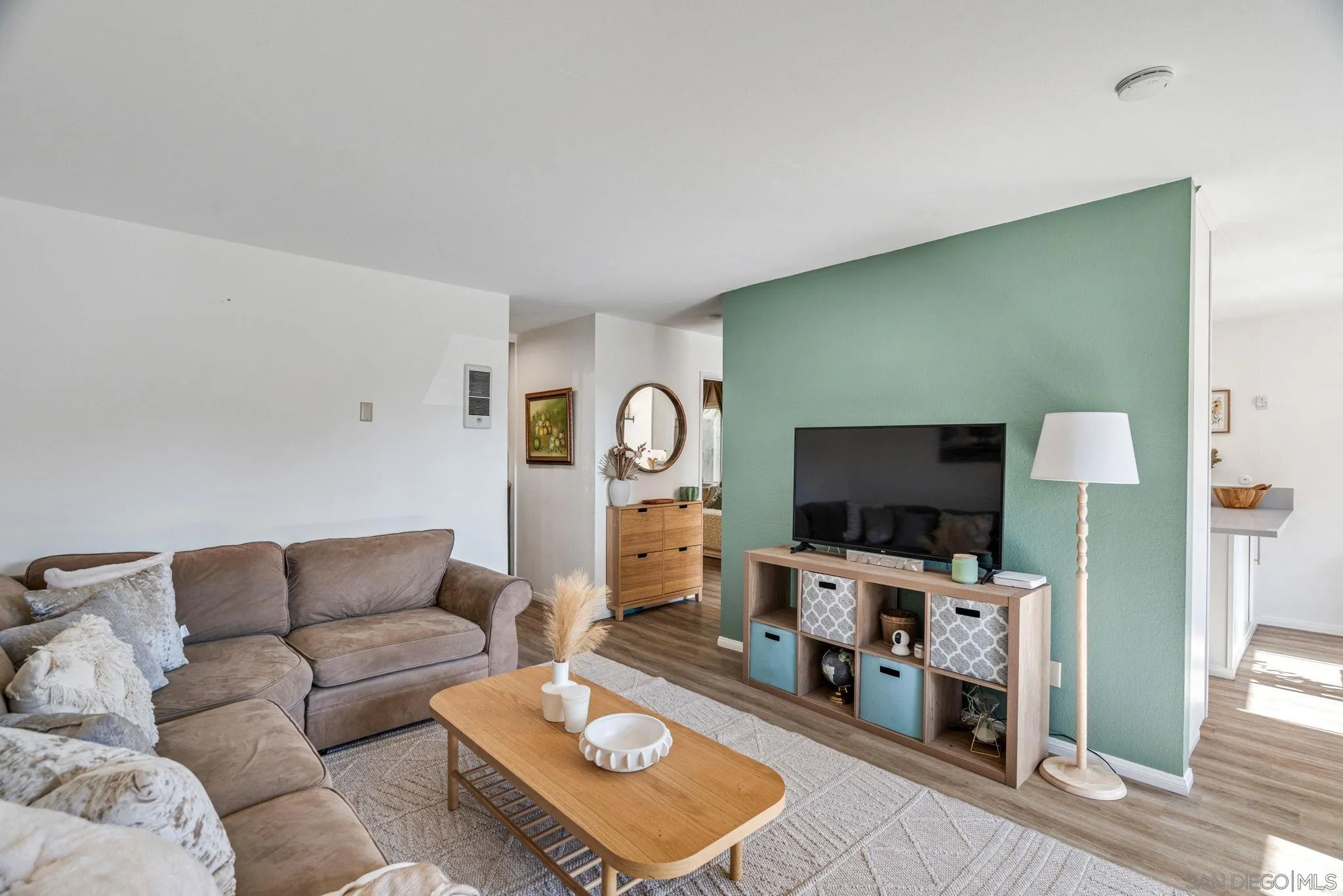5553 Adobe Falls Road, Unit 1 San Diego, CA 92120 - Photo 7 of 21 a living room with furniture and a flat screen tv