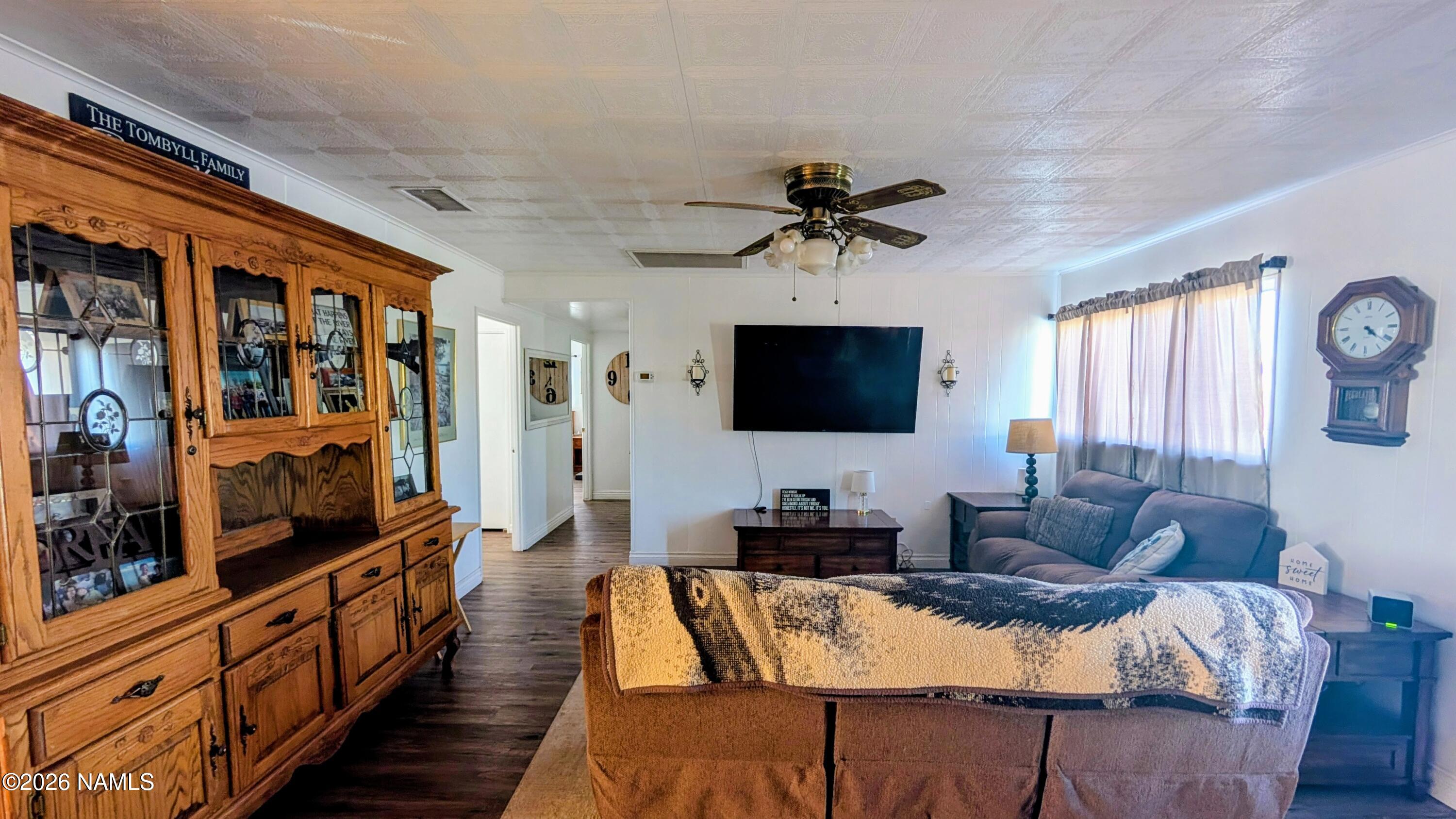 15702 Bonanza Loop Ehrenberg, AZ 85334 - Photo 3 of 13 a living room with furniture and a flat screen tv
