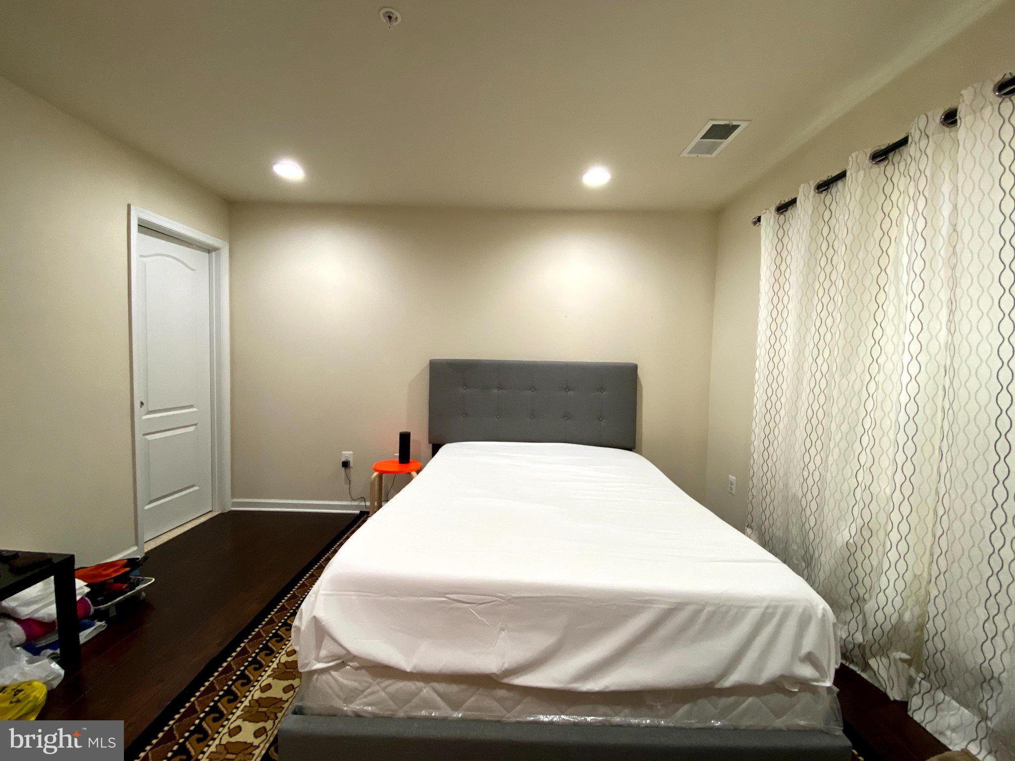 7014 Foxton Way Hanover, MD 21076 - Photo 10 of 29 Serene bedroom with natural light.