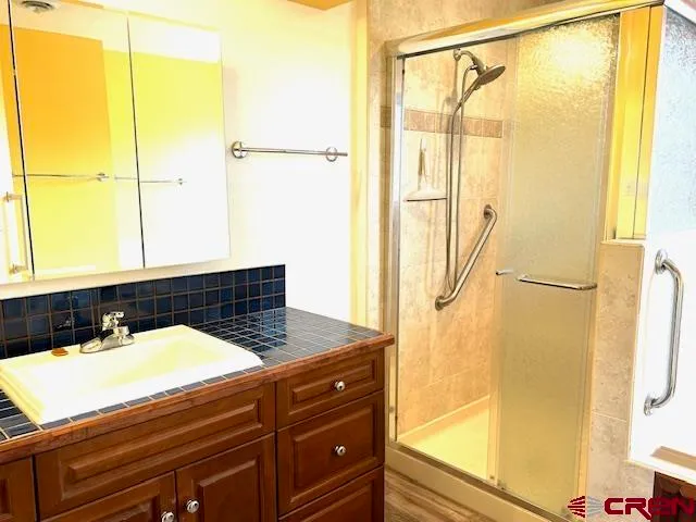 a view of a room with wooden floor