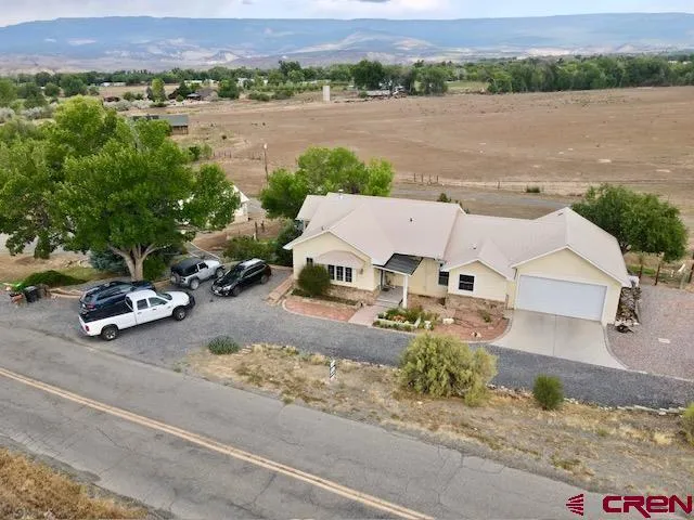 a view of a yard in front view of a house