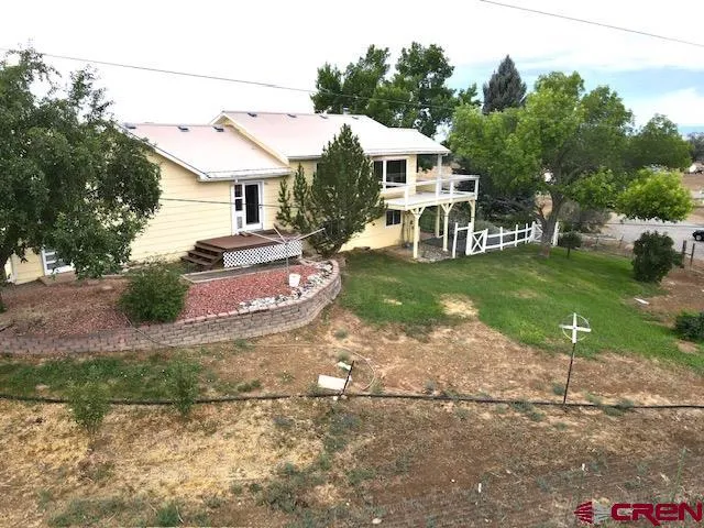 a view of a park with large trees