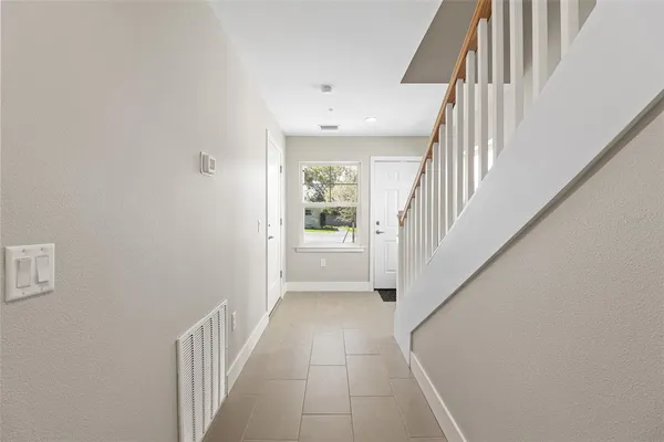 a view of a hallway with windows