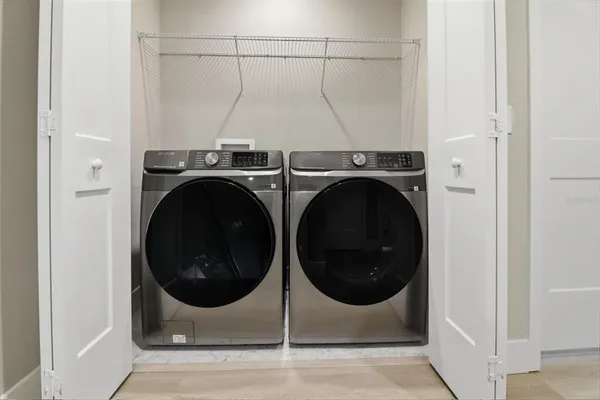 a utility room with dryer and washer