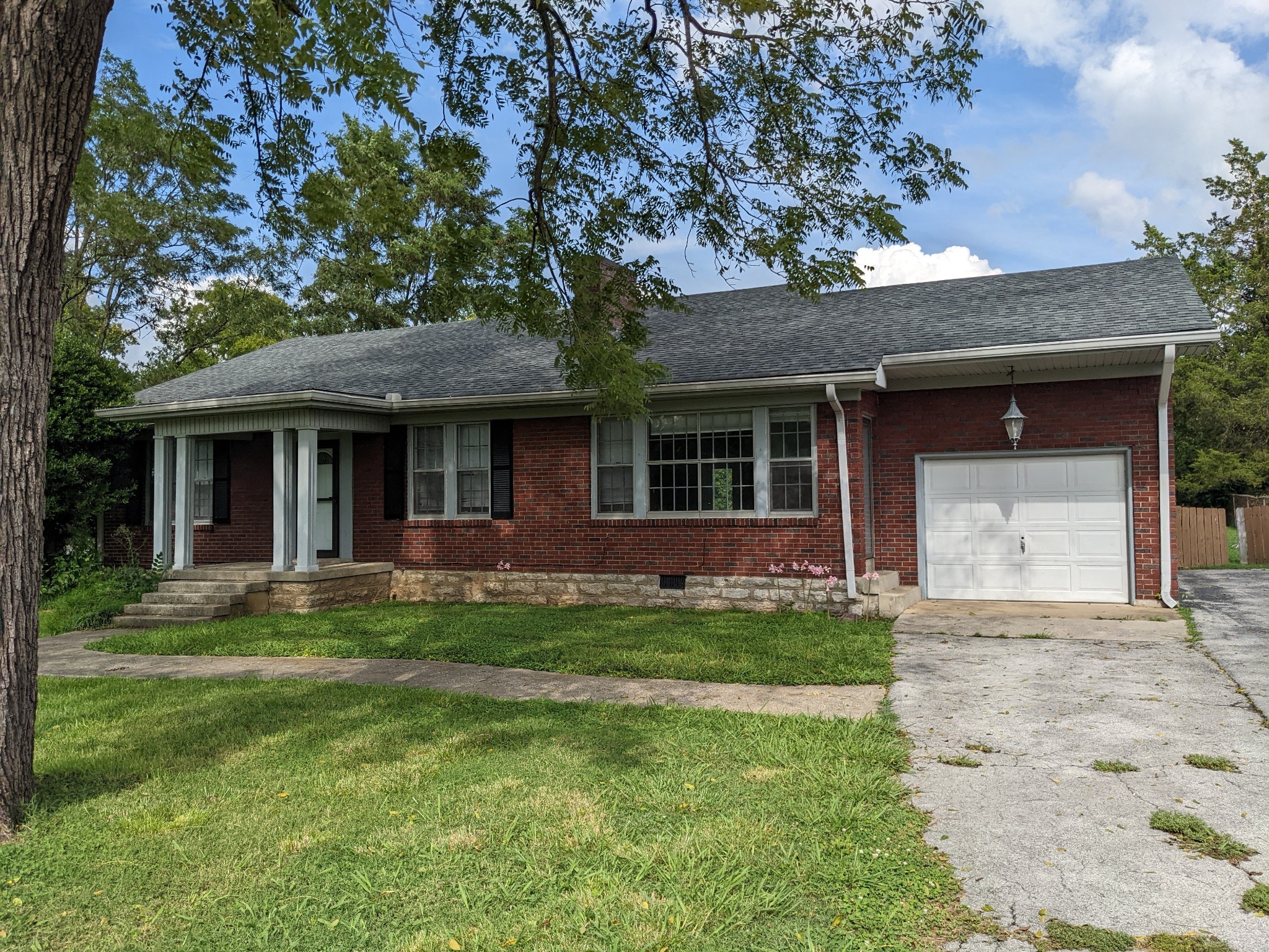 front view of a house with a garden