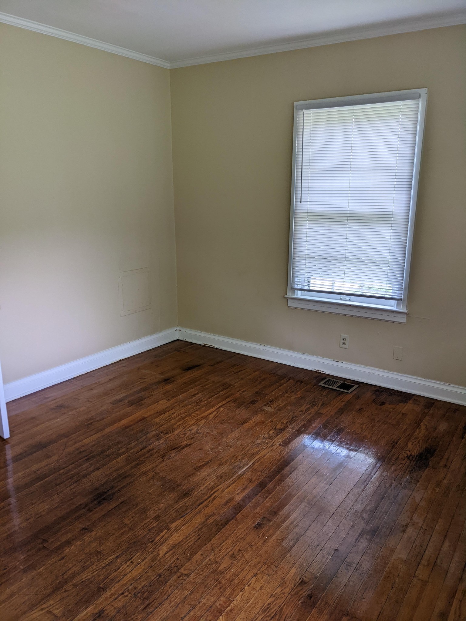 1289 Hunters Point Pike Lebanon, TN 37087 - Photo 11 of 15 a view of an empty room with wooden floor and a window