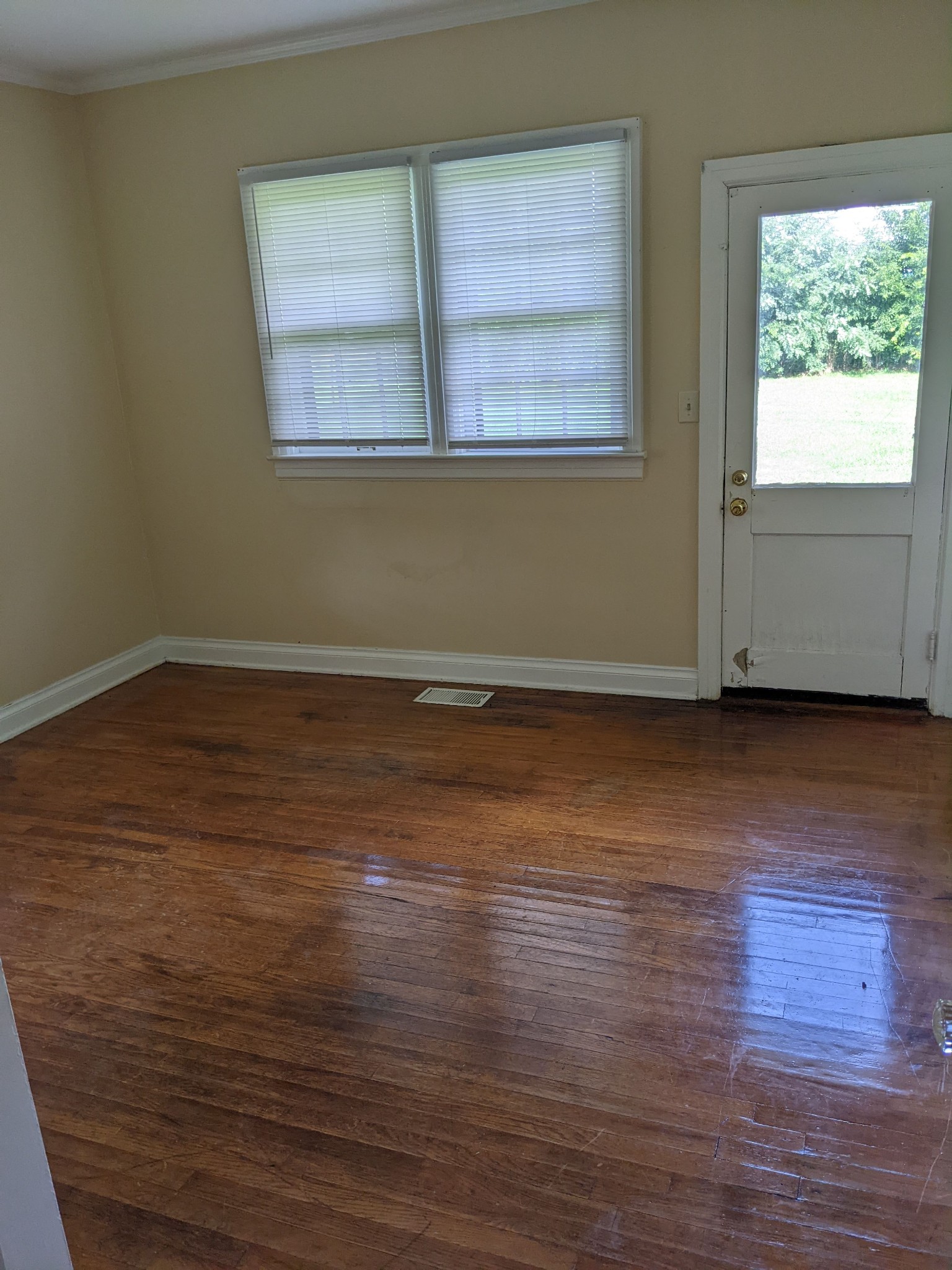 1289 Hunters Point Pike Lebanon, TN 37087 - Photo 12 of 15 an empty room with wooden floor and windows
