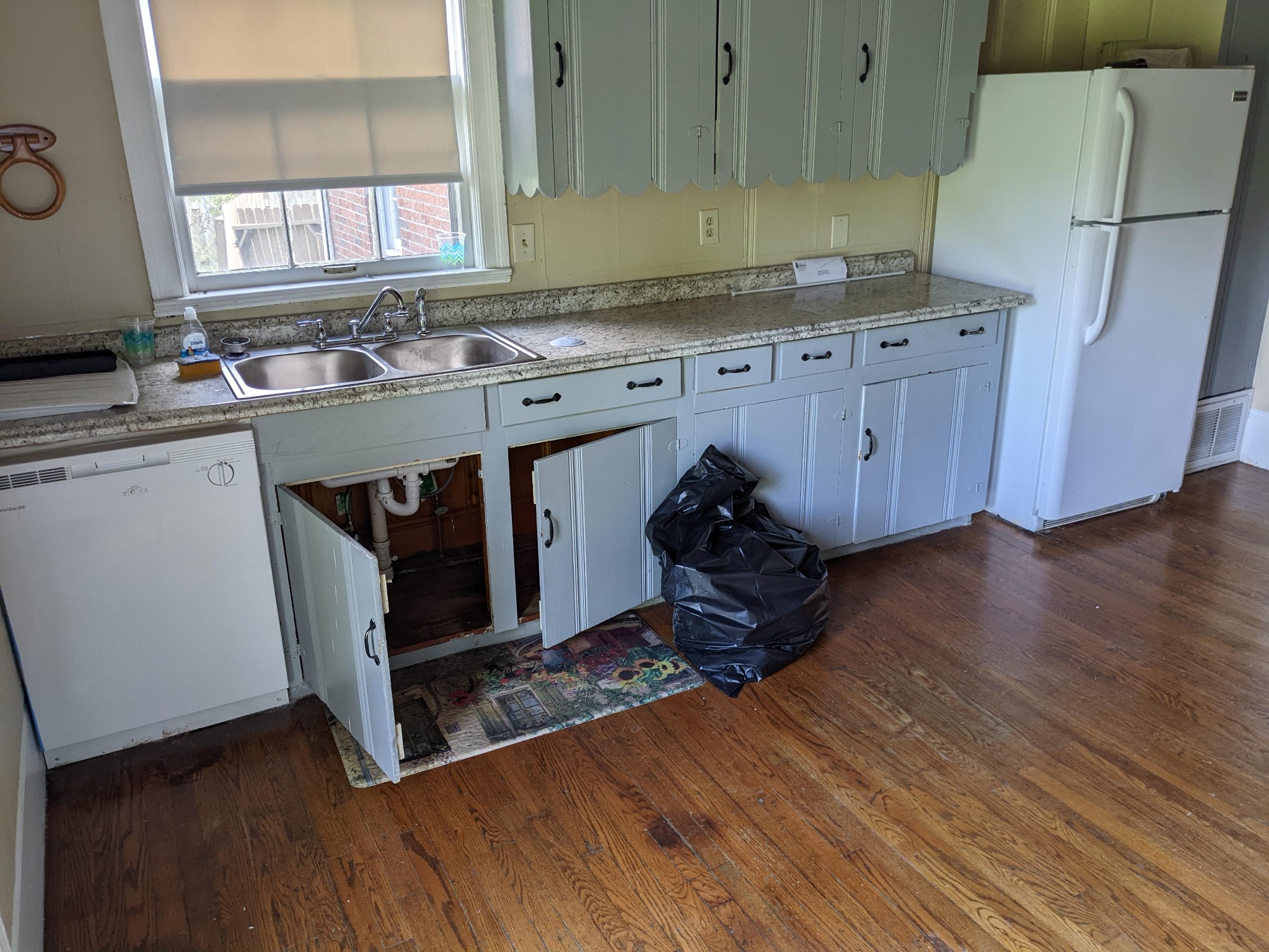 1289 Hunters Point Pike Lebanon, TN 37087 - Photo 6 of 15 a kitchen with granite countertop a sink cabinets and wooden floor