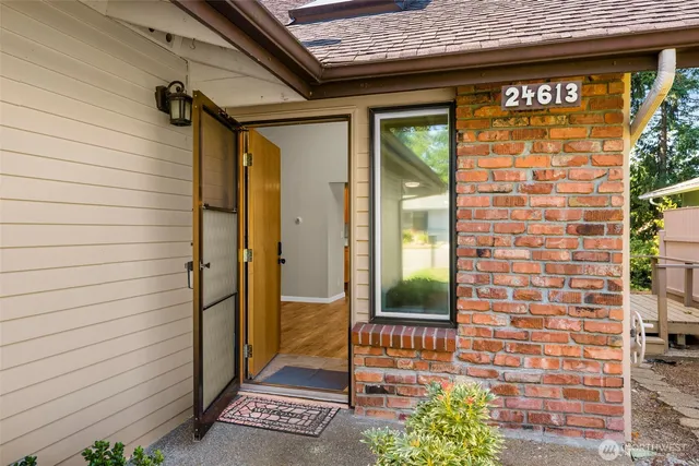 a view of a door and a window