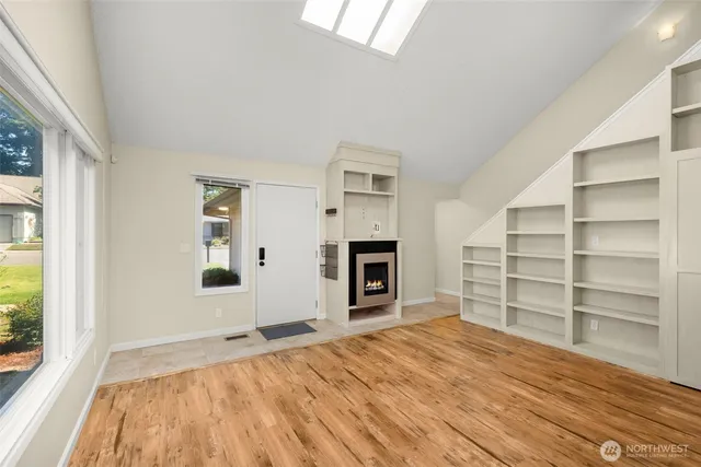 a room with a bed and a window