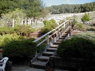 5571 Yerba Buena Road Santa Rosa, CA 95409 - Photo 4 of 5 a view of a balcony with lawn chairs and wooden fence