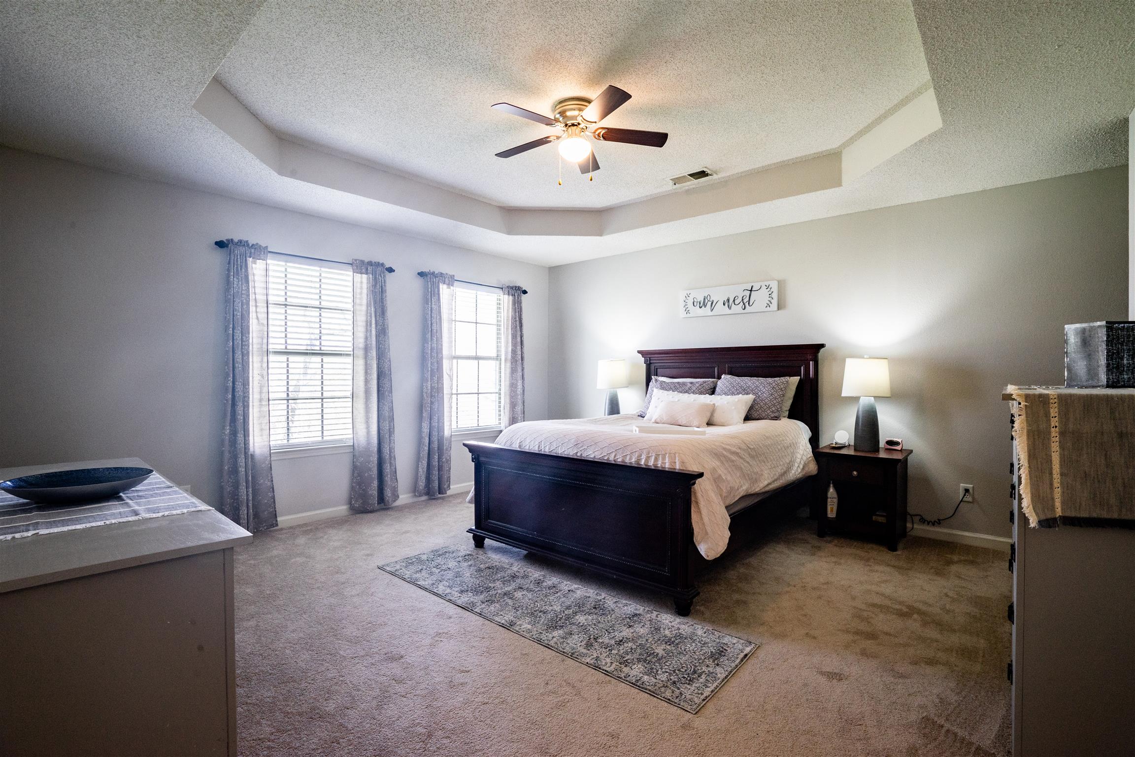 4002 Amber Way Spring Hill, TN 37174 - Photo 13 of 21 a spacious bedroom with a bed and a ceiling fan