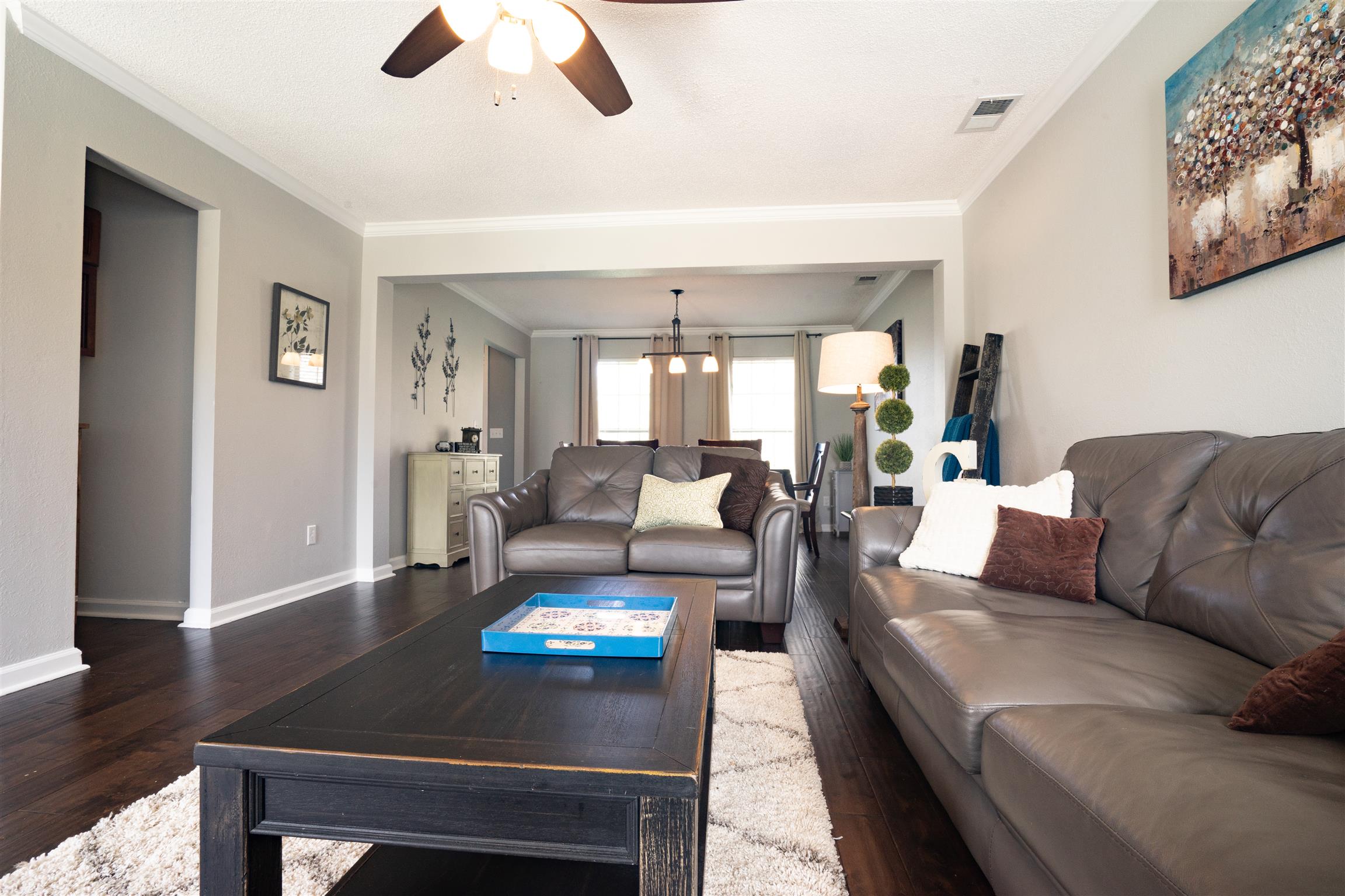 4002 Amber Way Spring Hill, TN 37174 - Photo 8 of 21 a living room with furniture and a chandelier