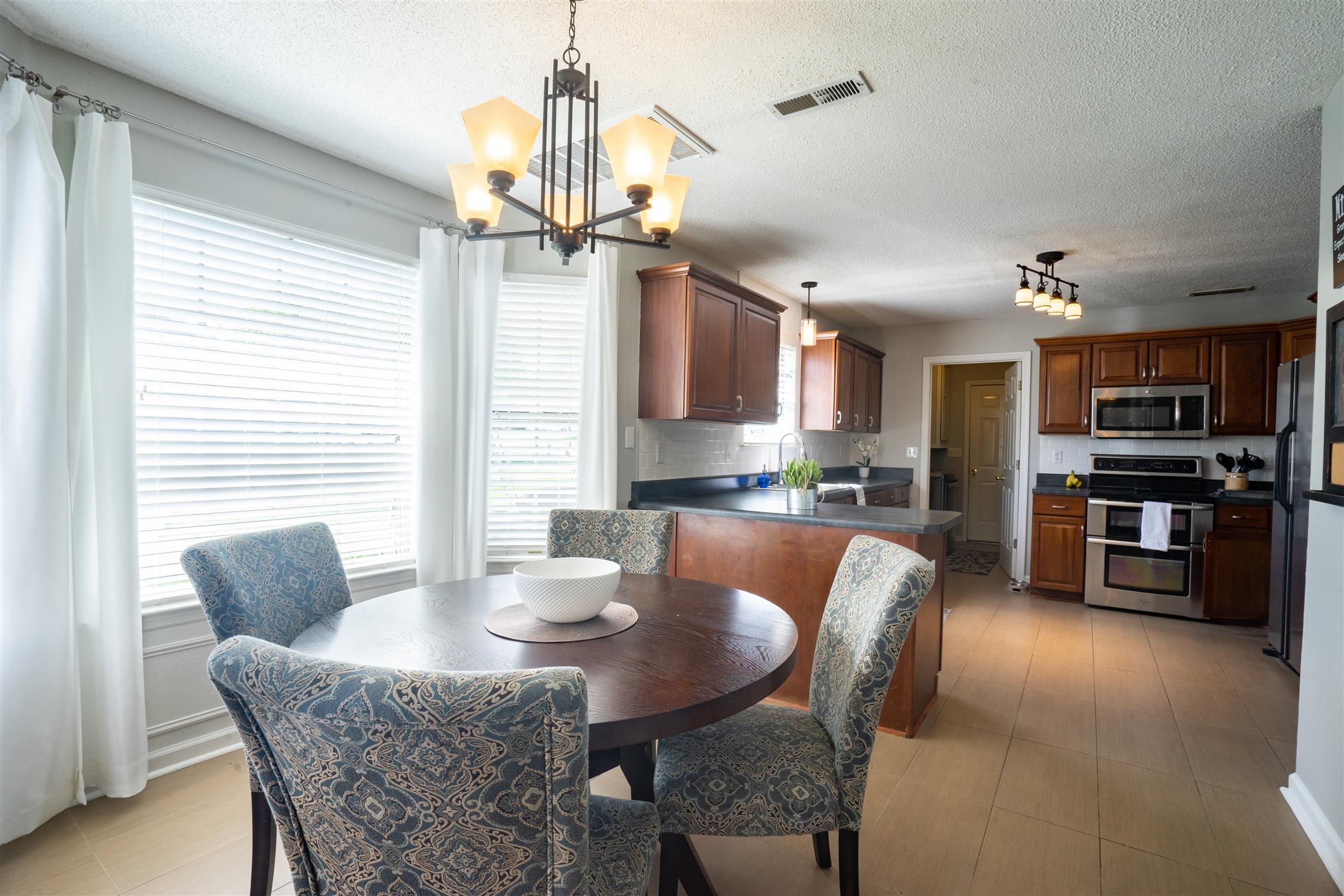 4002 Amber Way Spring Hill, TN 37174 - Photo 9 of 21 a dining room with furniture a window and kitchen view
