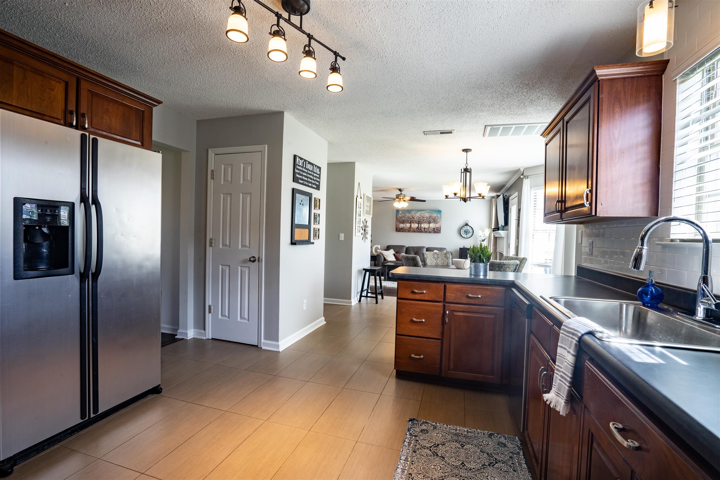 4002 Amber Way Spring Hill, TN 37174 - Photo 10 of 21 a kitchen with stainless steel appliances granite countertop a refrigerator and a sink