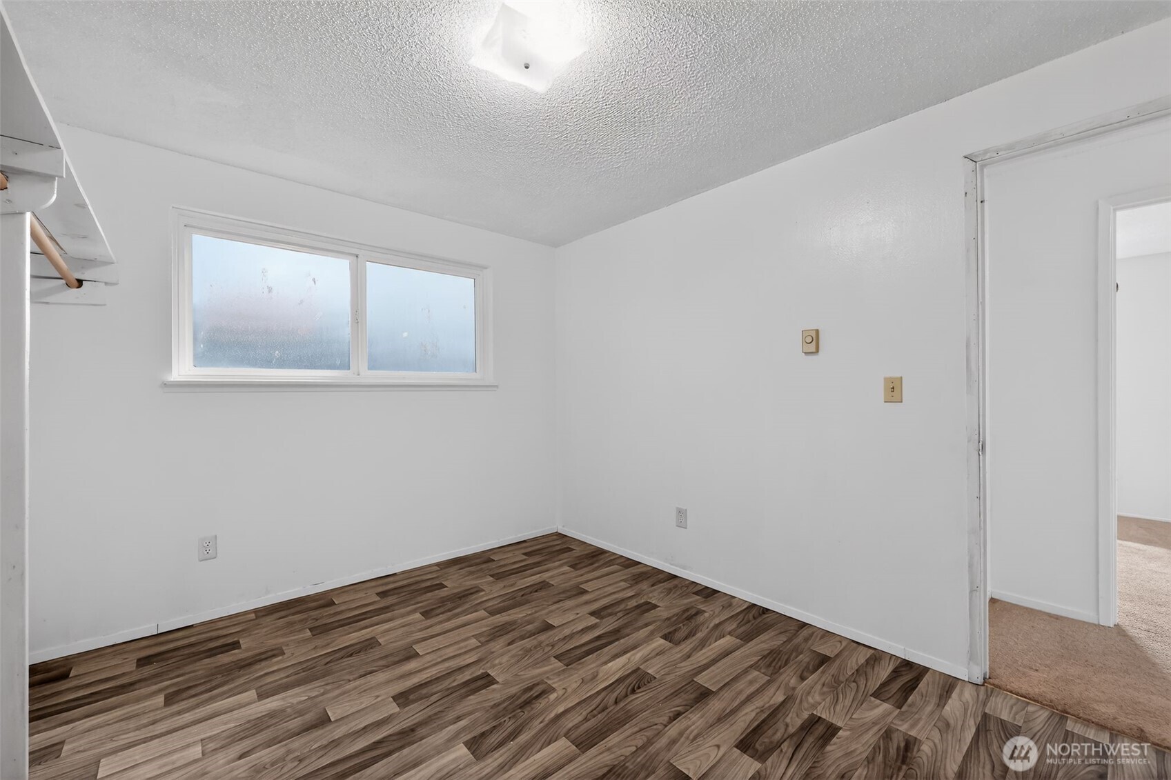 1010 Coolidge Road Aberdeen, WA 98520 - Photo 17 of 22 a view of a room with wooden floor and closet
