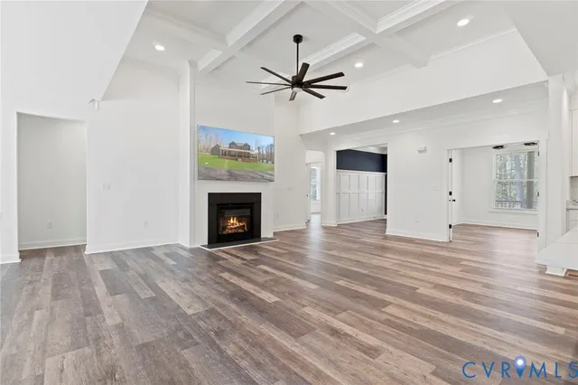 a kitchen with kitchen island granite countertop wooden cabinets and a sink