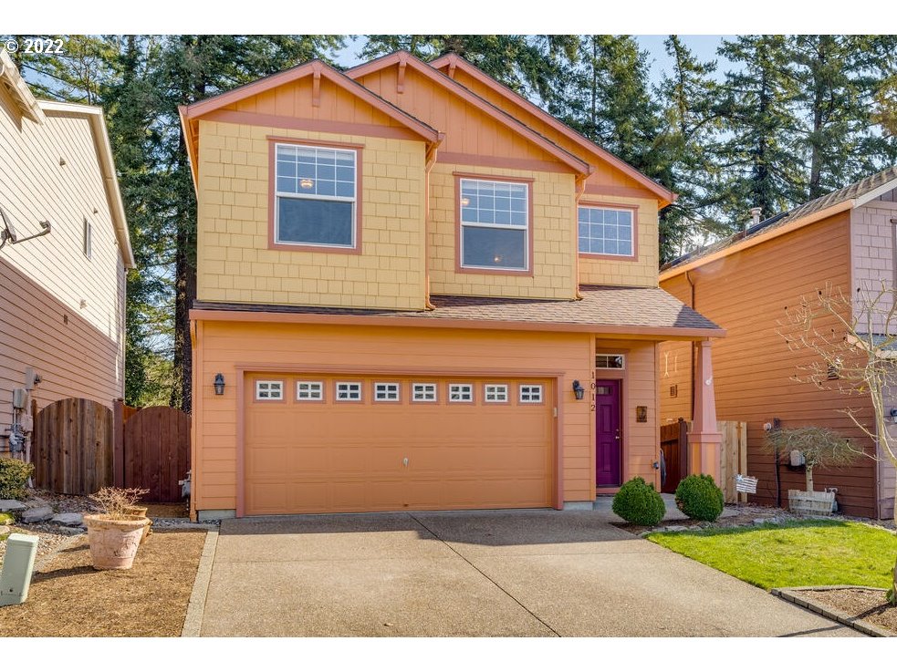 1012 57th Street Washougal, WA 98671 - Photo 1 of 31 a view of a house with a yard and garage