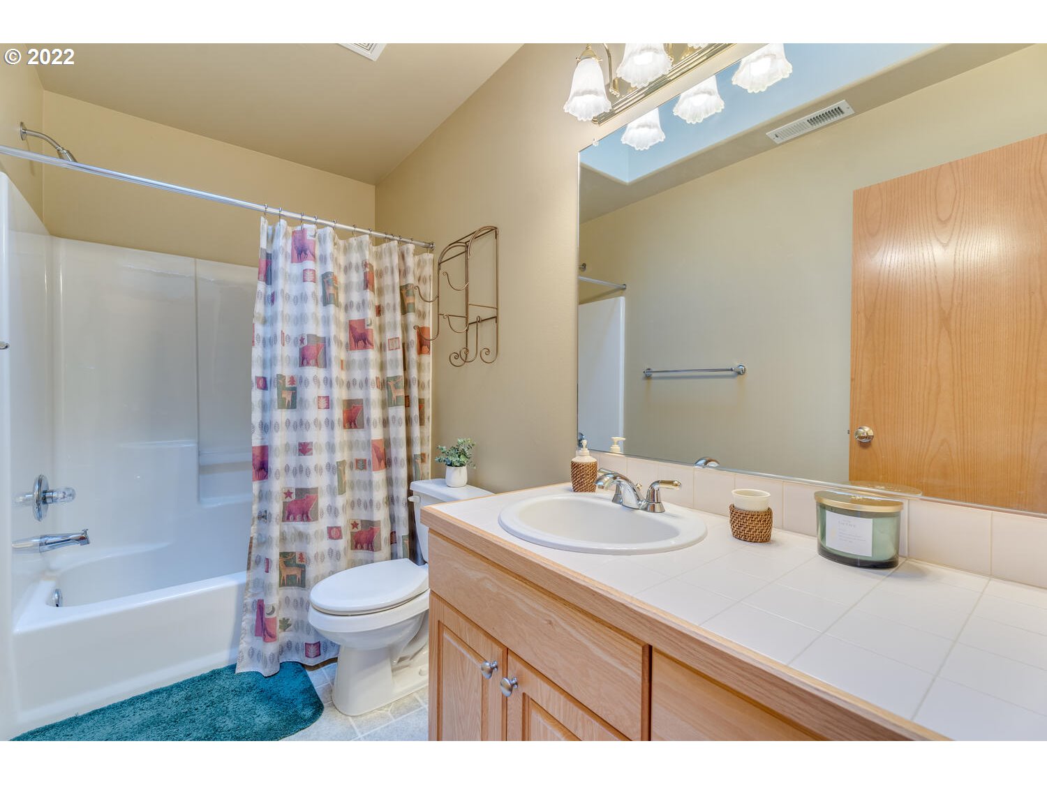 1012 57th Street Washougal, WA 98671 - Photo 16 of 31 a bathroom with a sink a toilet and shower