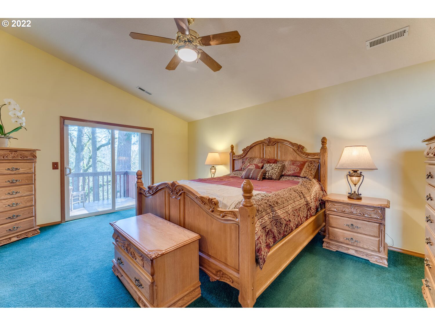 1012 57th Street Washougal, WA 98671 - Photo 18 of 31 a bedroom with a bed window and a chandelier