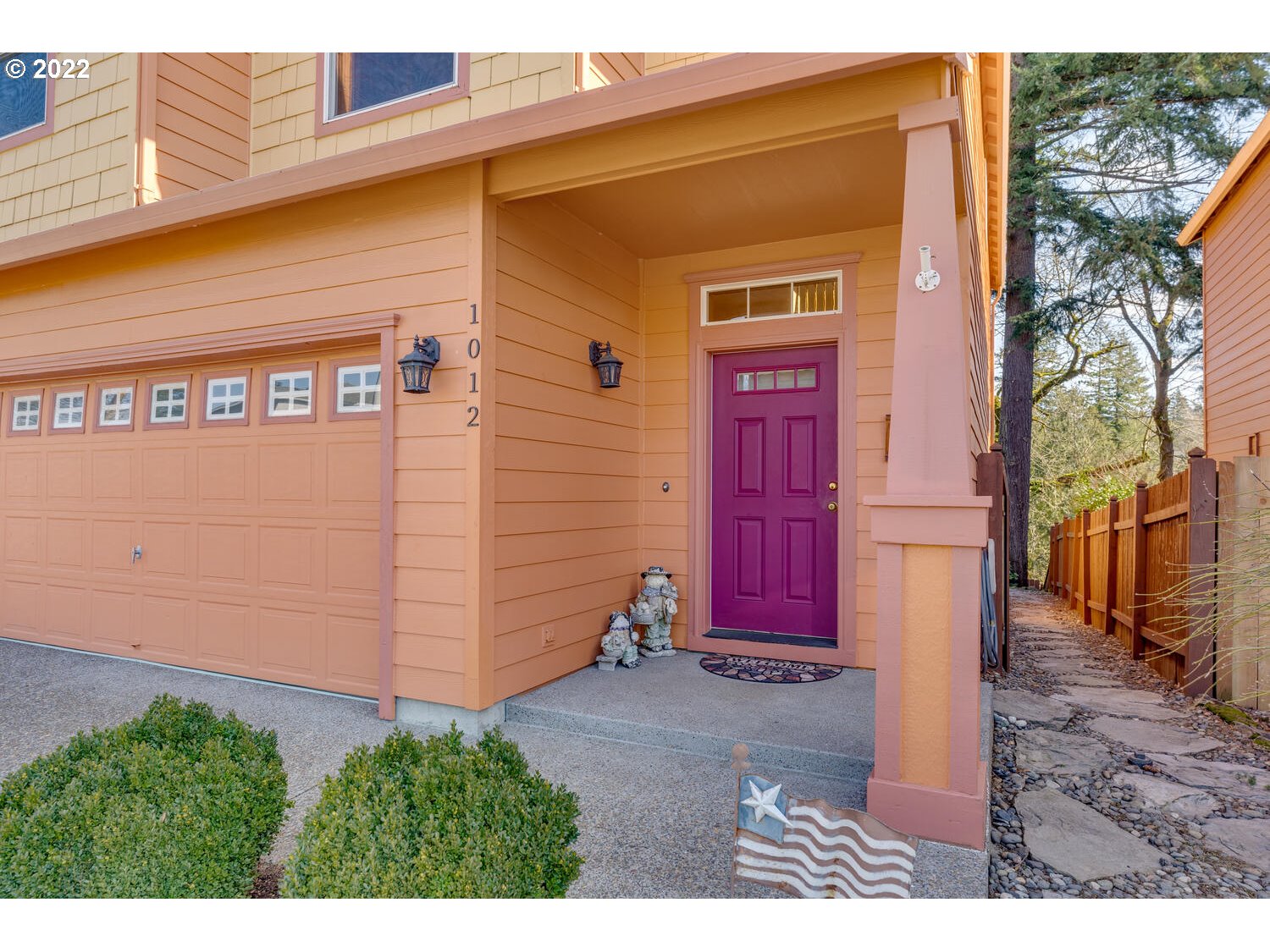 1012 57th Street Washougal, WA 98671 - Photo 2 of 31 a view of a house with a door and wooden bench