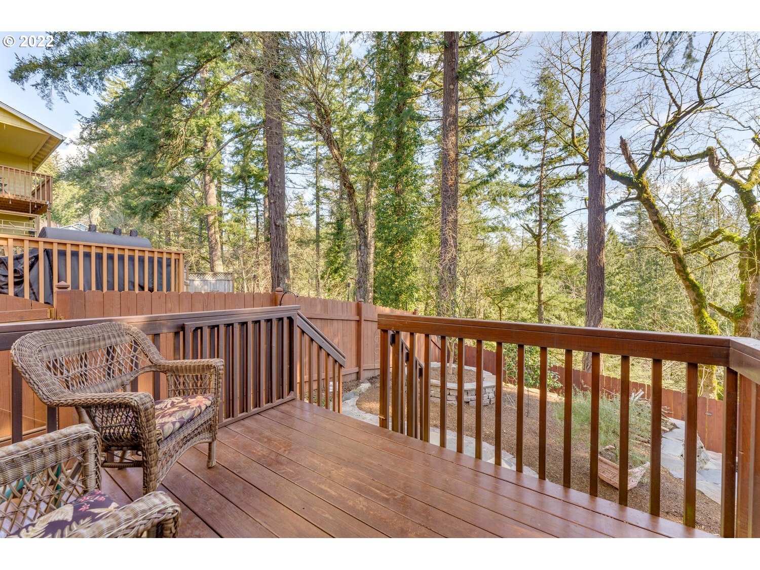 1012 57th Street Washougal, WA 98671 - Photo 27 of 31 a view of a wooden chairs and bench on the roof deck