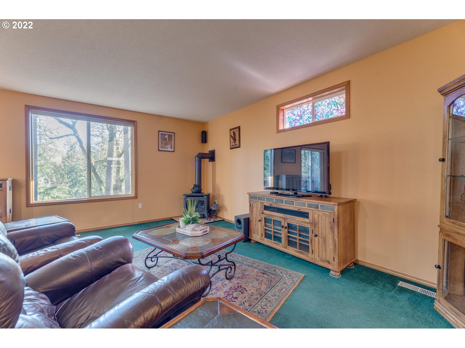 1012 57th Street Washougal, WA 98671 - Photo 3 of 31 a living room with furniture and a flat screen tv