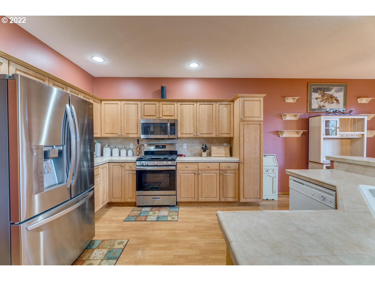 1012 57th Street Washougal, WA 98671 - Photo 10 of 31 a kitchen with a refrigerator and a sink