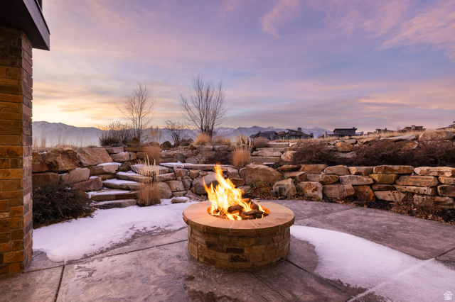 707 Chimney Rock Road, Unit 247 Heber City, UT 84032 - Photo 49 of 64 View of patio featuring a mountain view and a fire pit