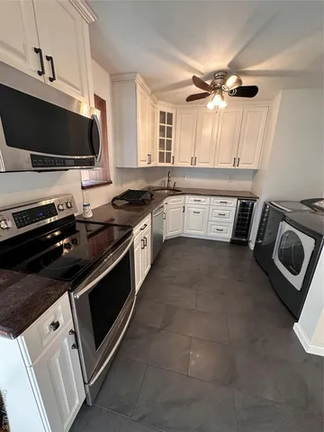 a kitchen with a stove and a microwave