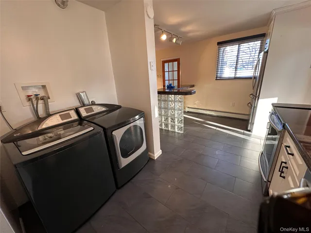 a utility room with dryer and washer