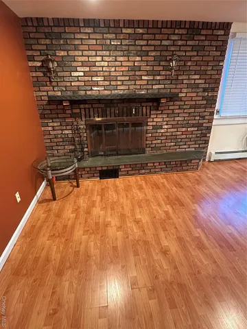 a view of outdoor space with wooden floor